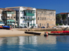 Stone Town, Zanzibar, Tanzania: boats and beach by the Old Customs house - Mizingani Road - photo by M.Torres