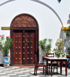 Stone Town, Zanzibar, Tanzania: carved door in the terrace - metal spikes - Tembo hotel - Shangani - photo by M.Torres