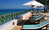 Stone Town, Zanzibar, Tanzania: deckchairs and parasols by the Indian ocean - Zanzibar Serena Inn - Shangani - photo by M.Torres