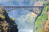 Victoria Falls, Matabeleland North, Zimbabwe: Victoria Falls Bridge aka Great Zambesi bridge - parabolic arch using a truss, braced spandrel type, designed by George Anthony Hobson and completed in 1905 - commissioned by Cecil John Rhodes in 1900 - used also for bungee jumping - photo by M.Torres